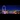 A wide-angle view of the neon-lit London Eye standing across from Westminster in the late evening.