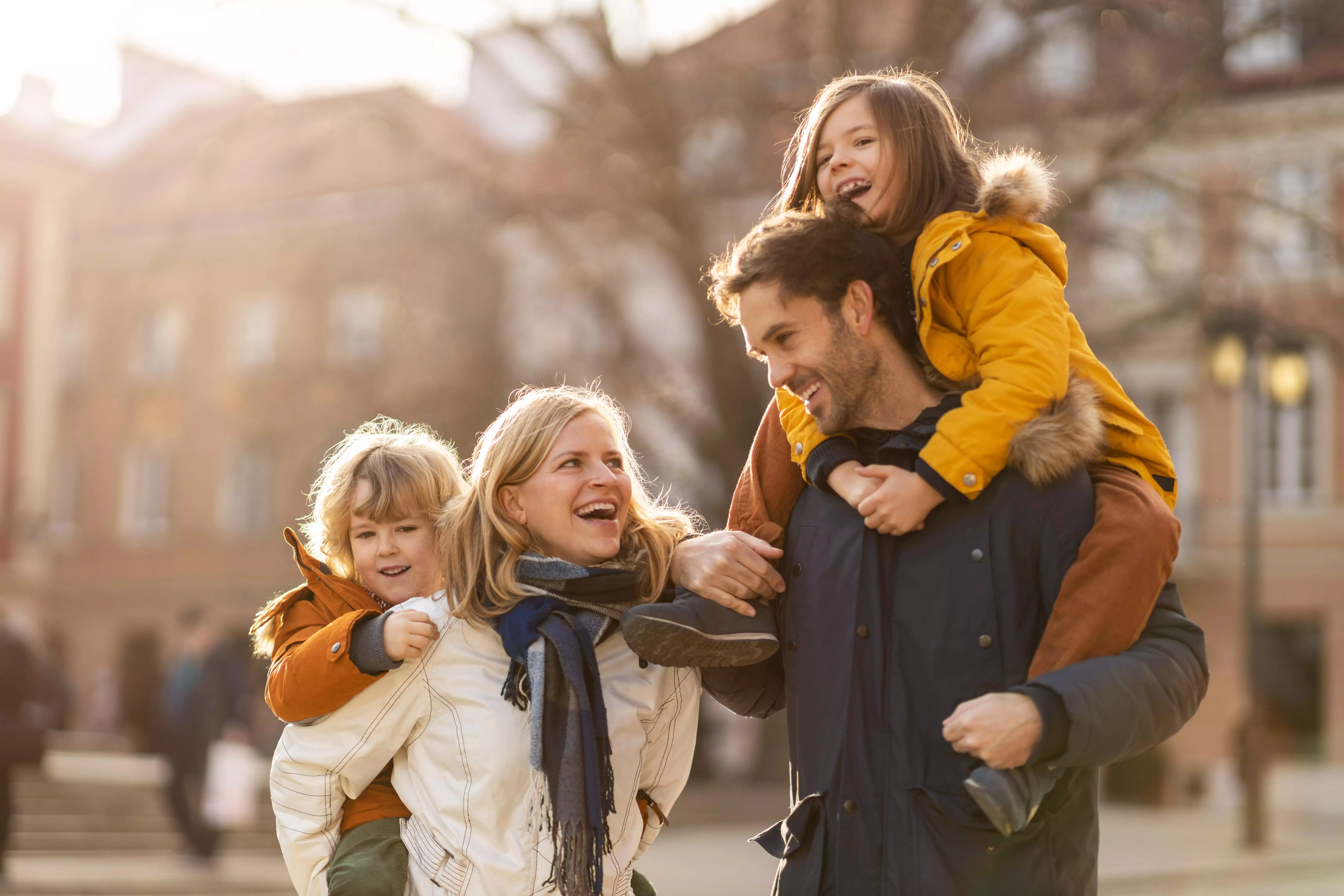 A family having fun walking through a city