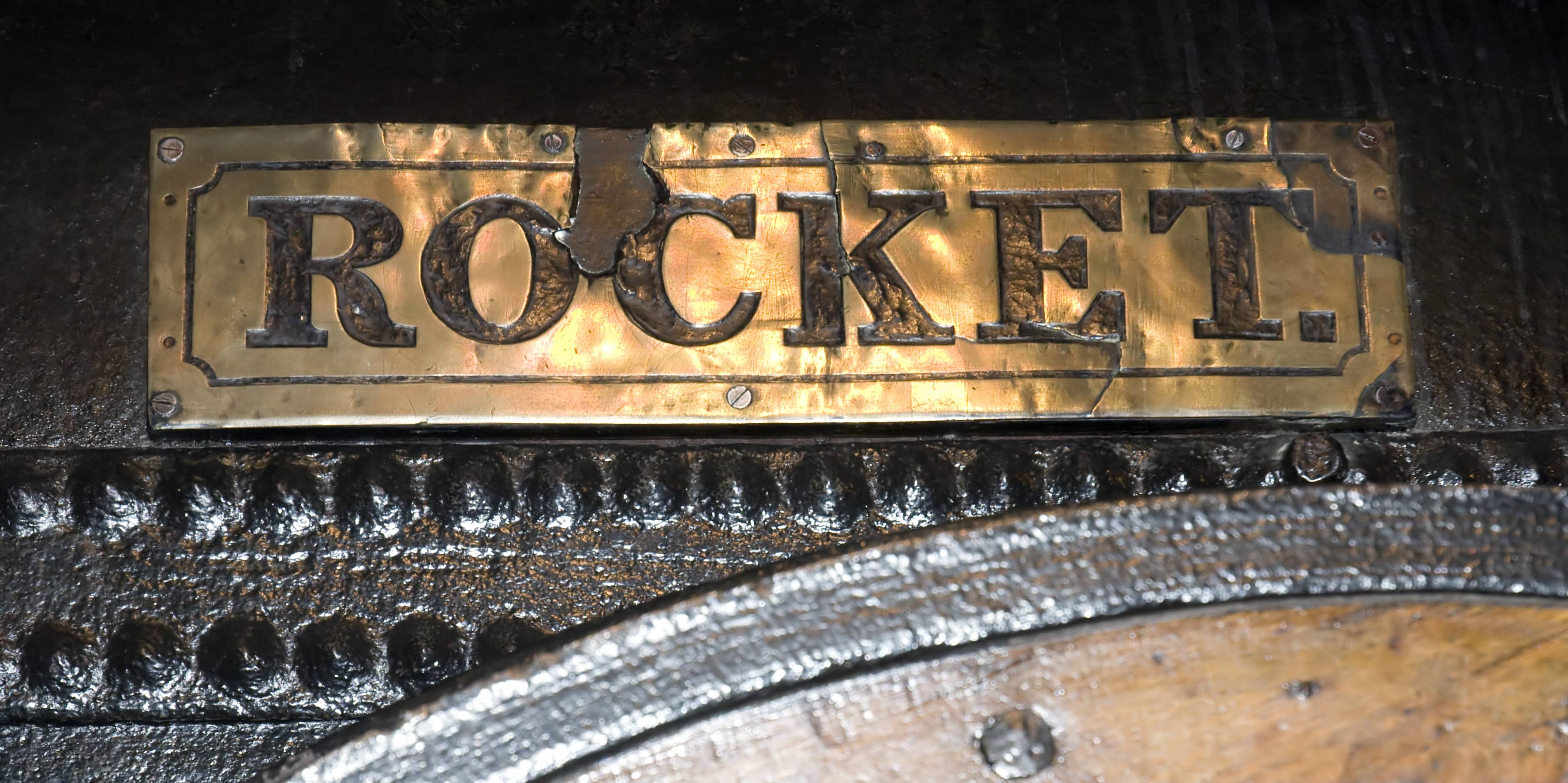 Railway Pioneers: A close-up of a gold-plated sign that has the word ‘rocket’ embossed into it.