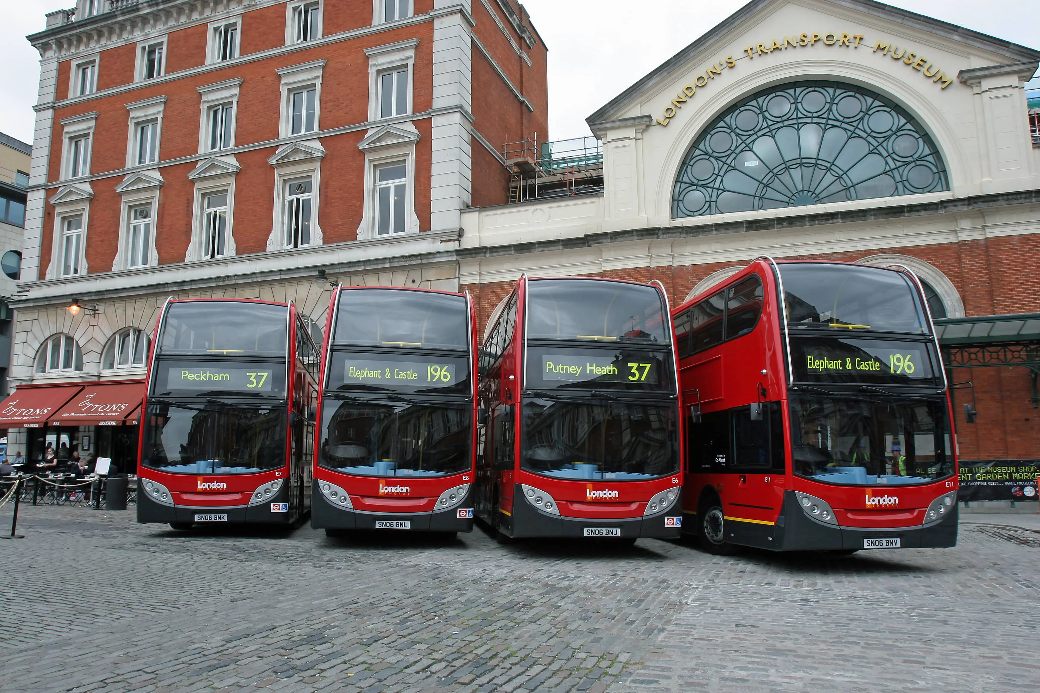 The Top Railway Museums in the UK: Four double-decker buses outside of London’s Transport Museum