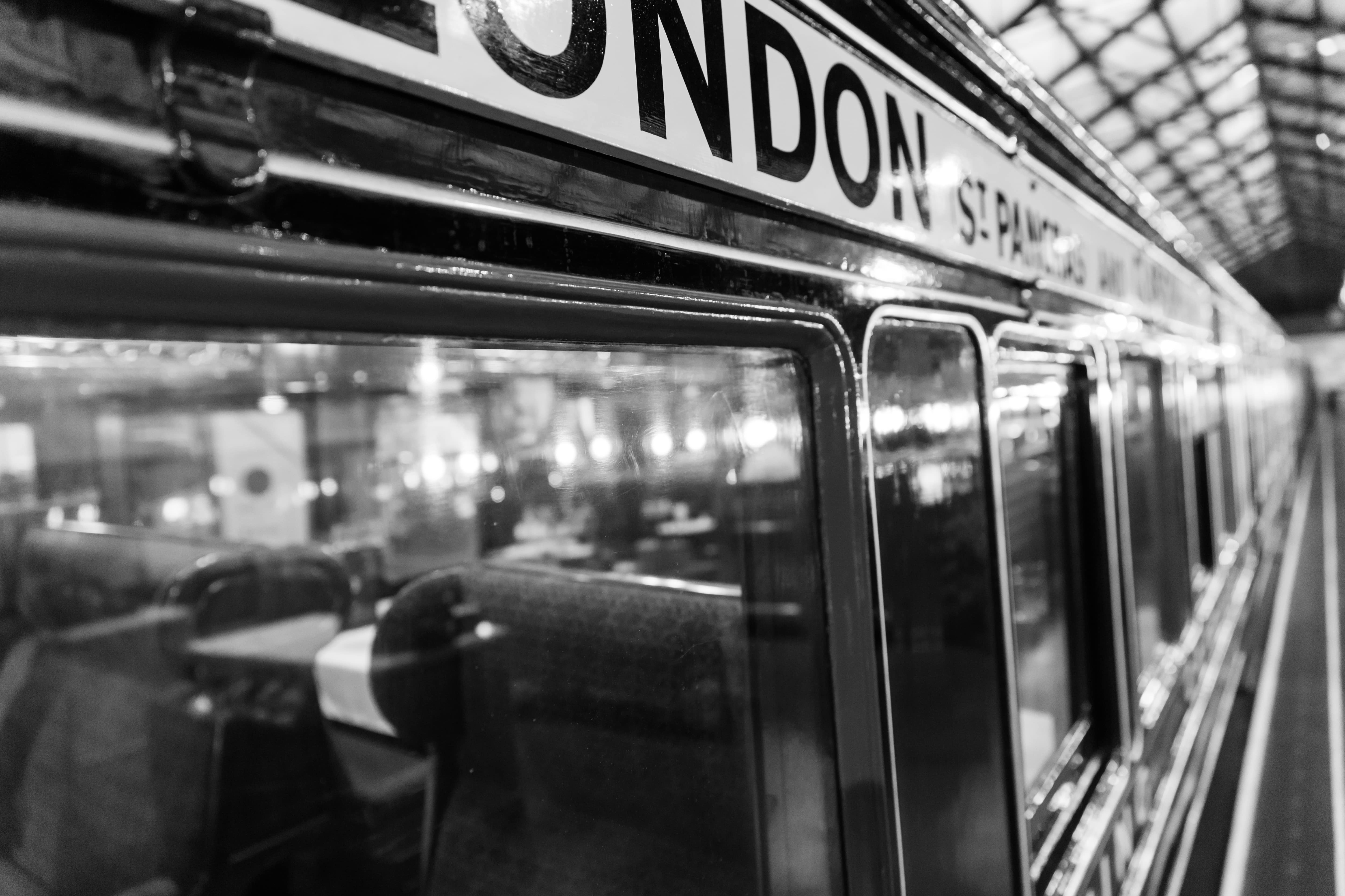 Bicentennial: Black and white close-up of a vintage train at the National Railway Museum in York, reflecting its classic interior