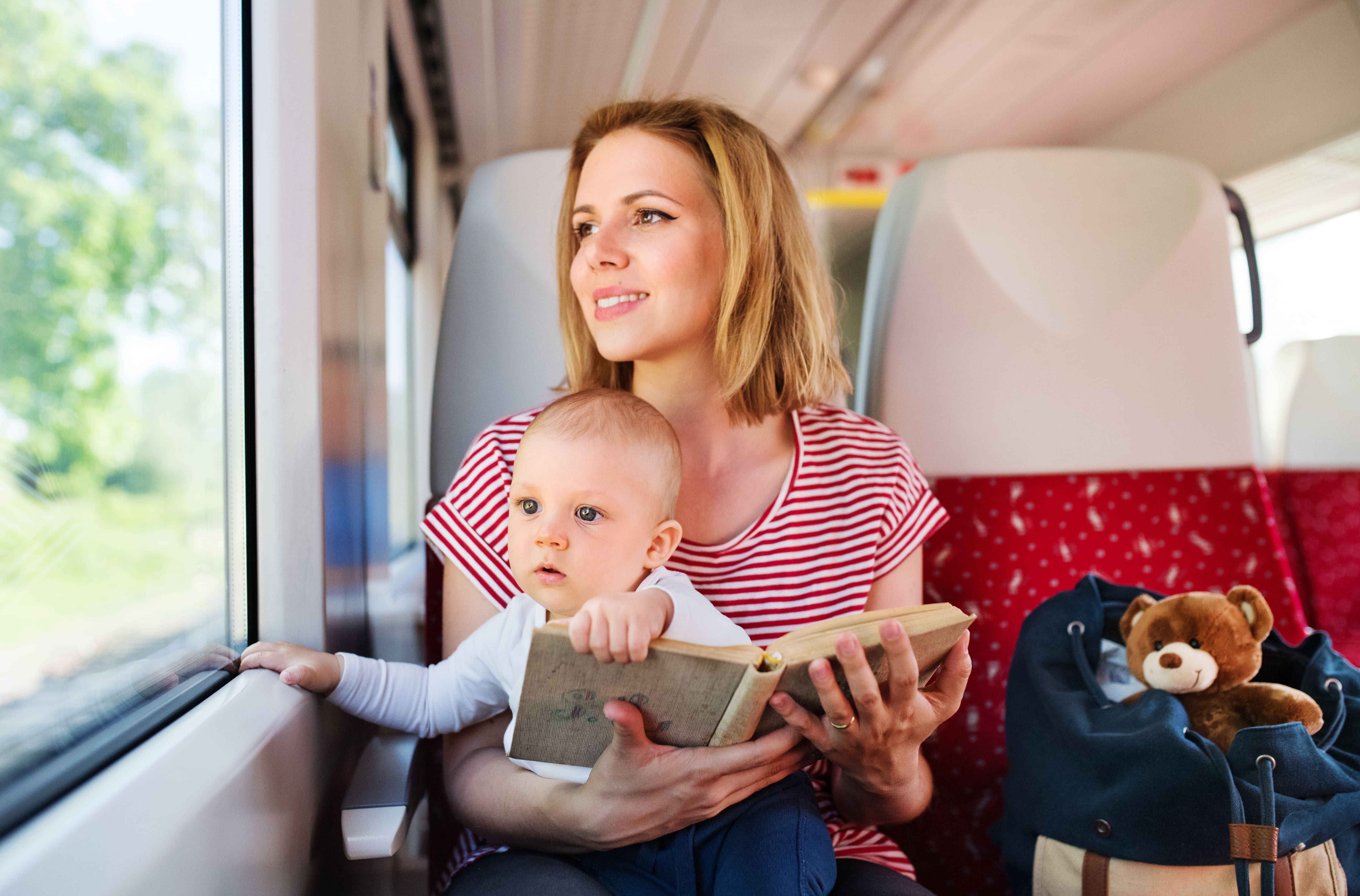 Fictional Trains: A young mother reads a book to her toddler whilst travelling on the train.