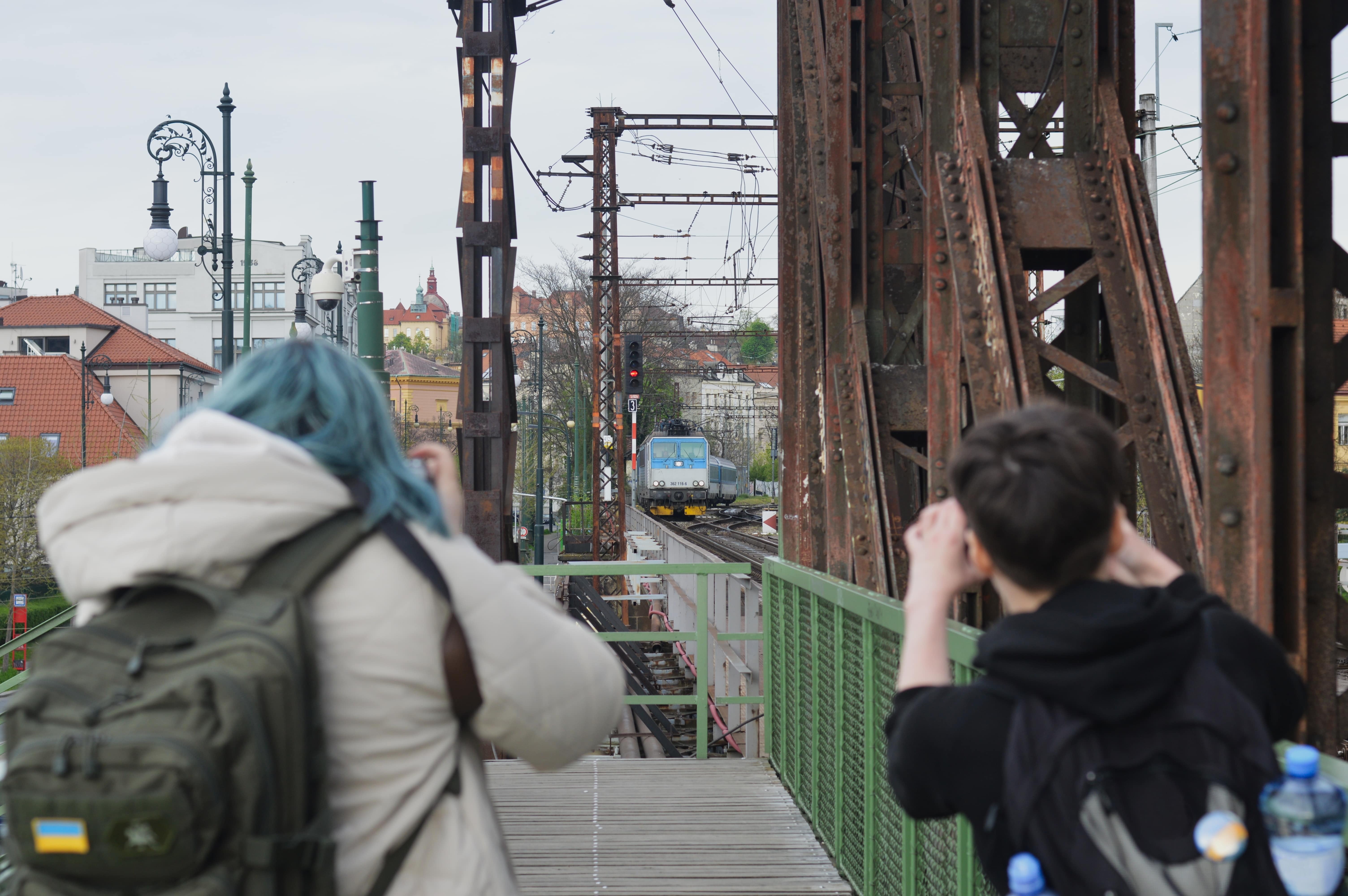 Train Spotting: Two women photographing a passing train