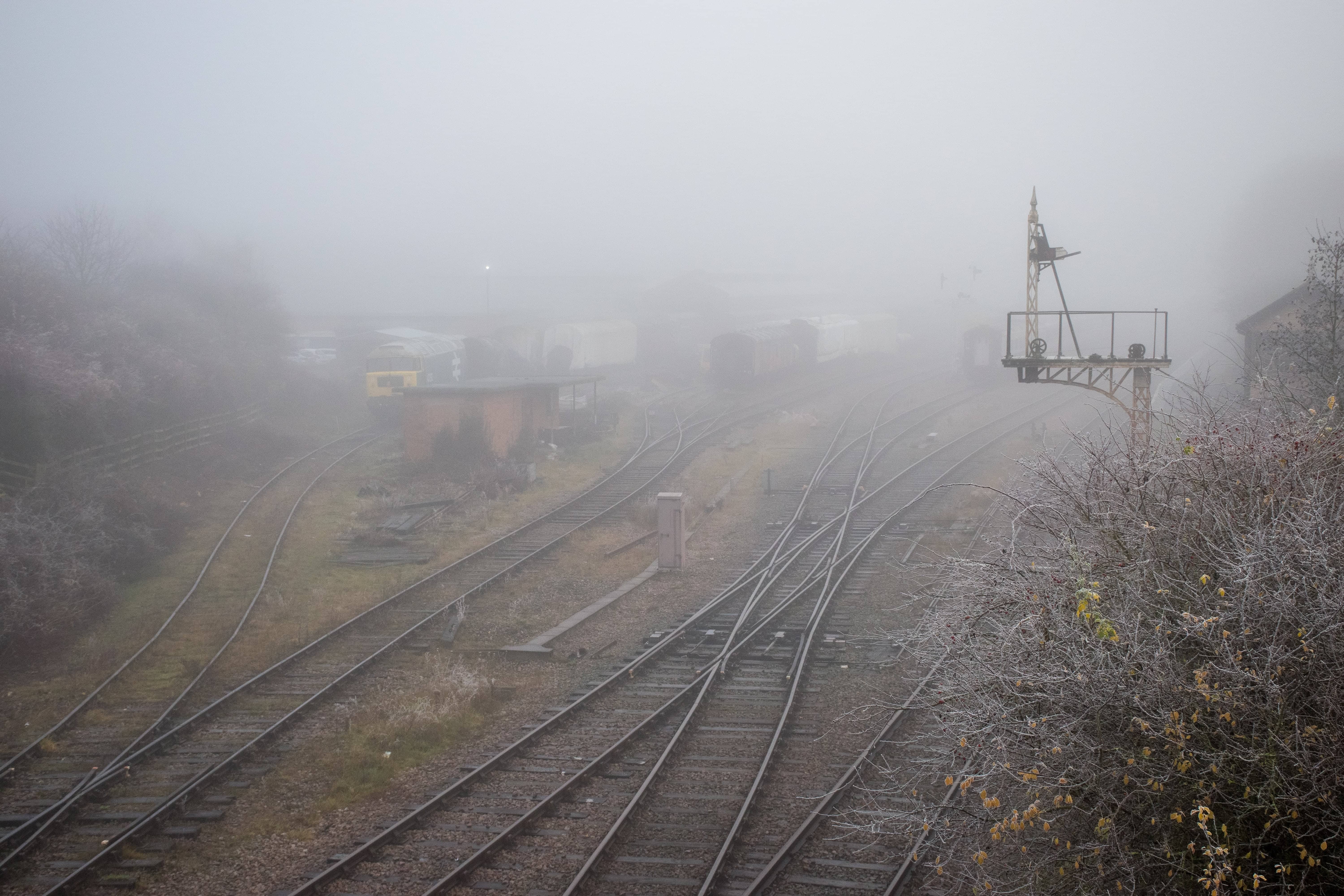 Films About Trains: An eerie stretch of railway tracks concealed by a thick fog.