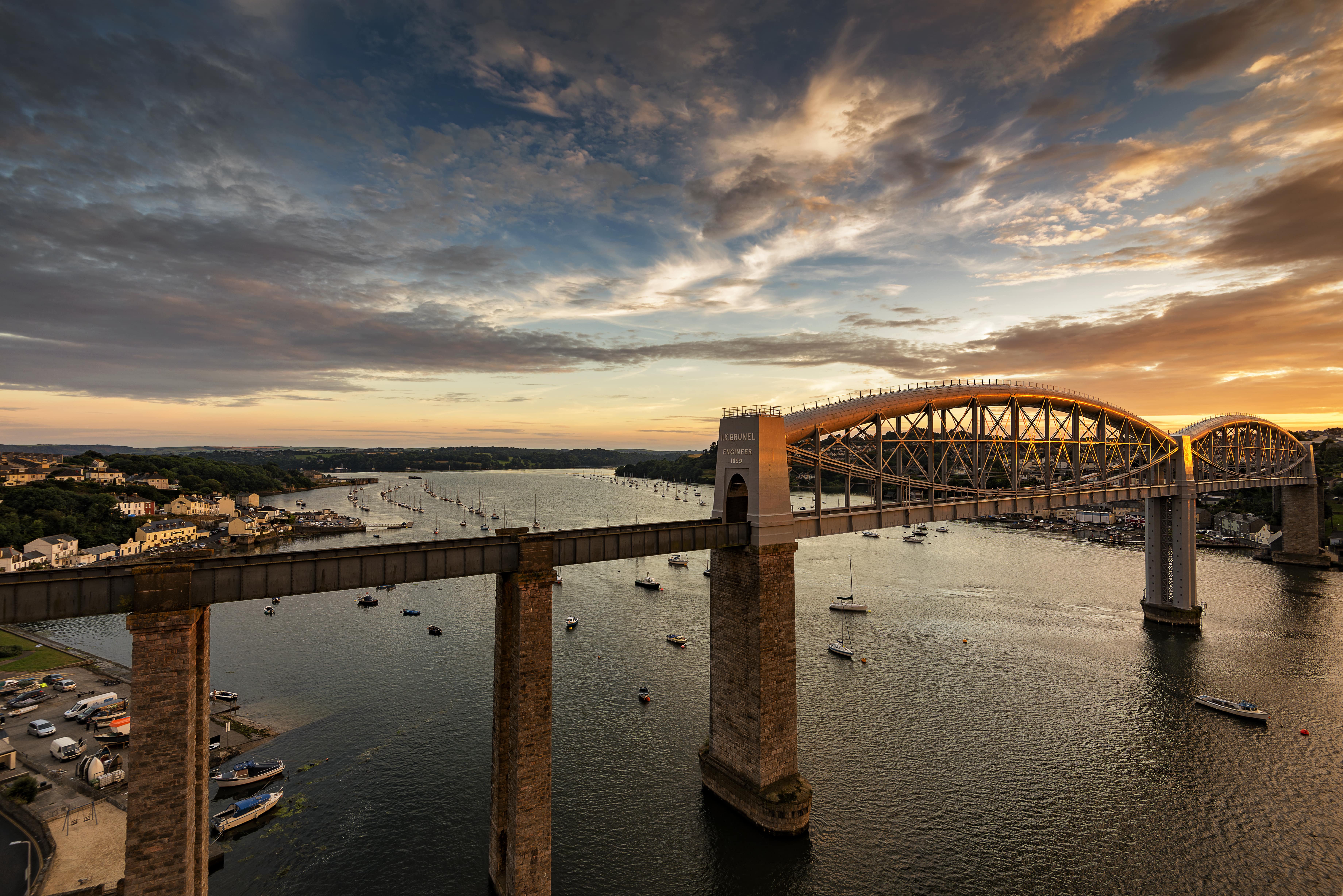 Train Travel for Leisure: A view of Royal Albert Bridge in Plymouth, just before sunset.
