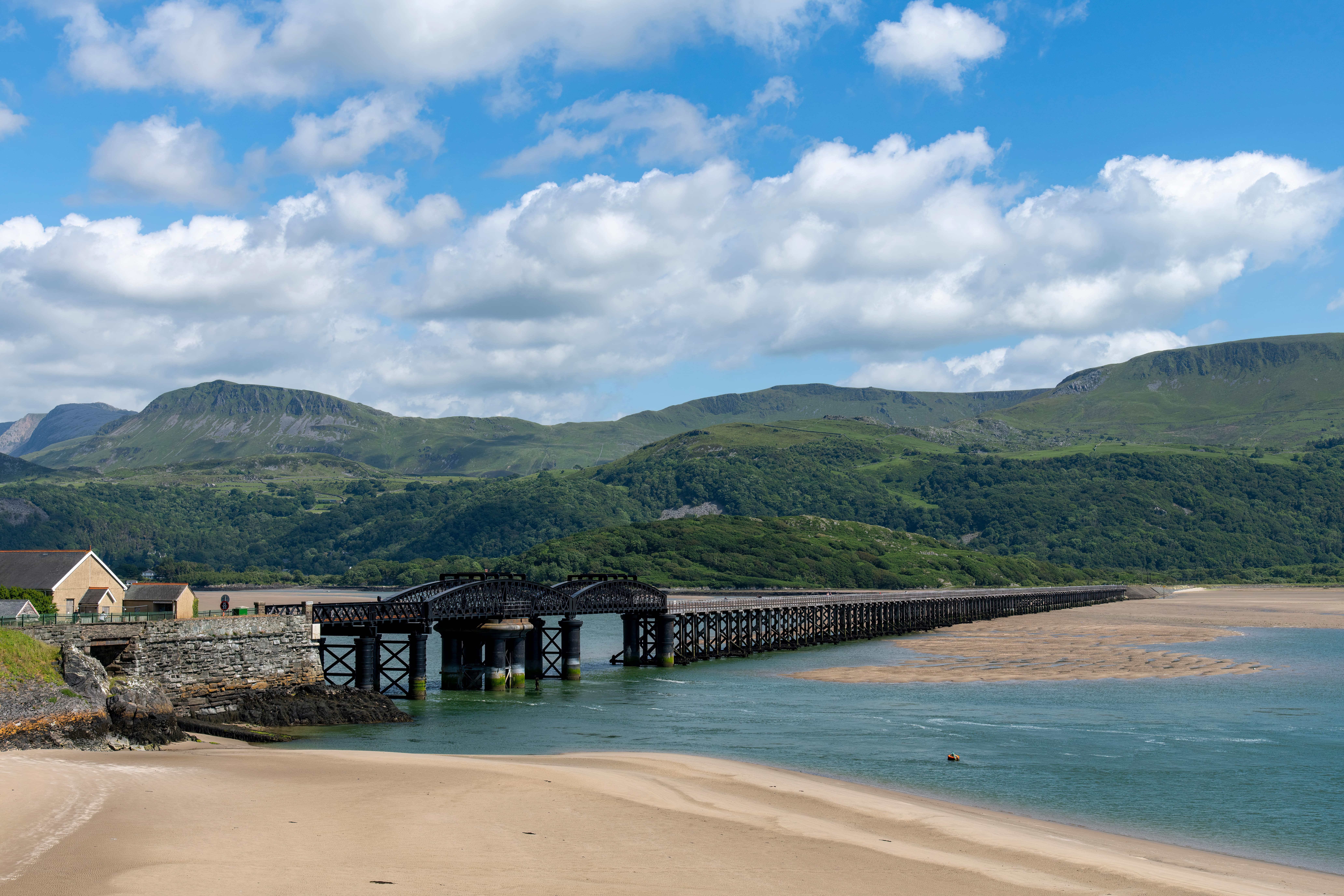 Train Travel for Leisure: A panoramic view over the Mawddach Estuary sandbanks near Barmouth.