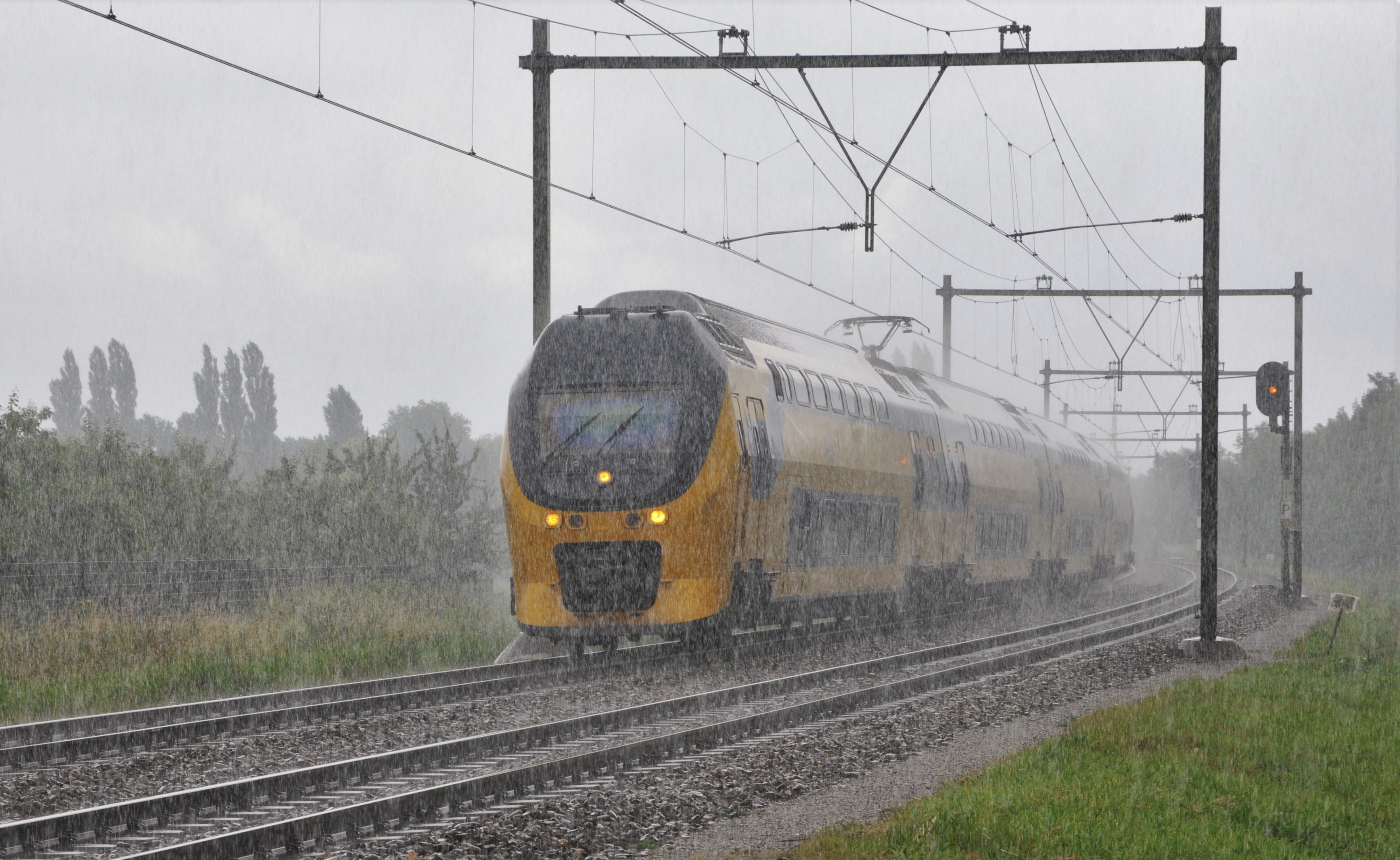 Eco-Friendly Transportation: Train in heavy rain