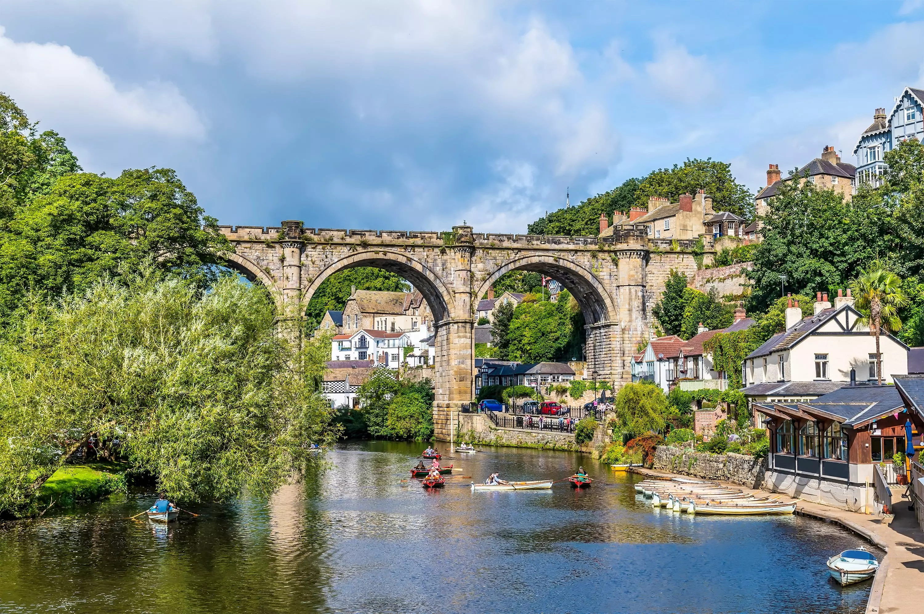 A view along the River Nidd towards the viaduct in the town of Knaresborough in Yorkshire.