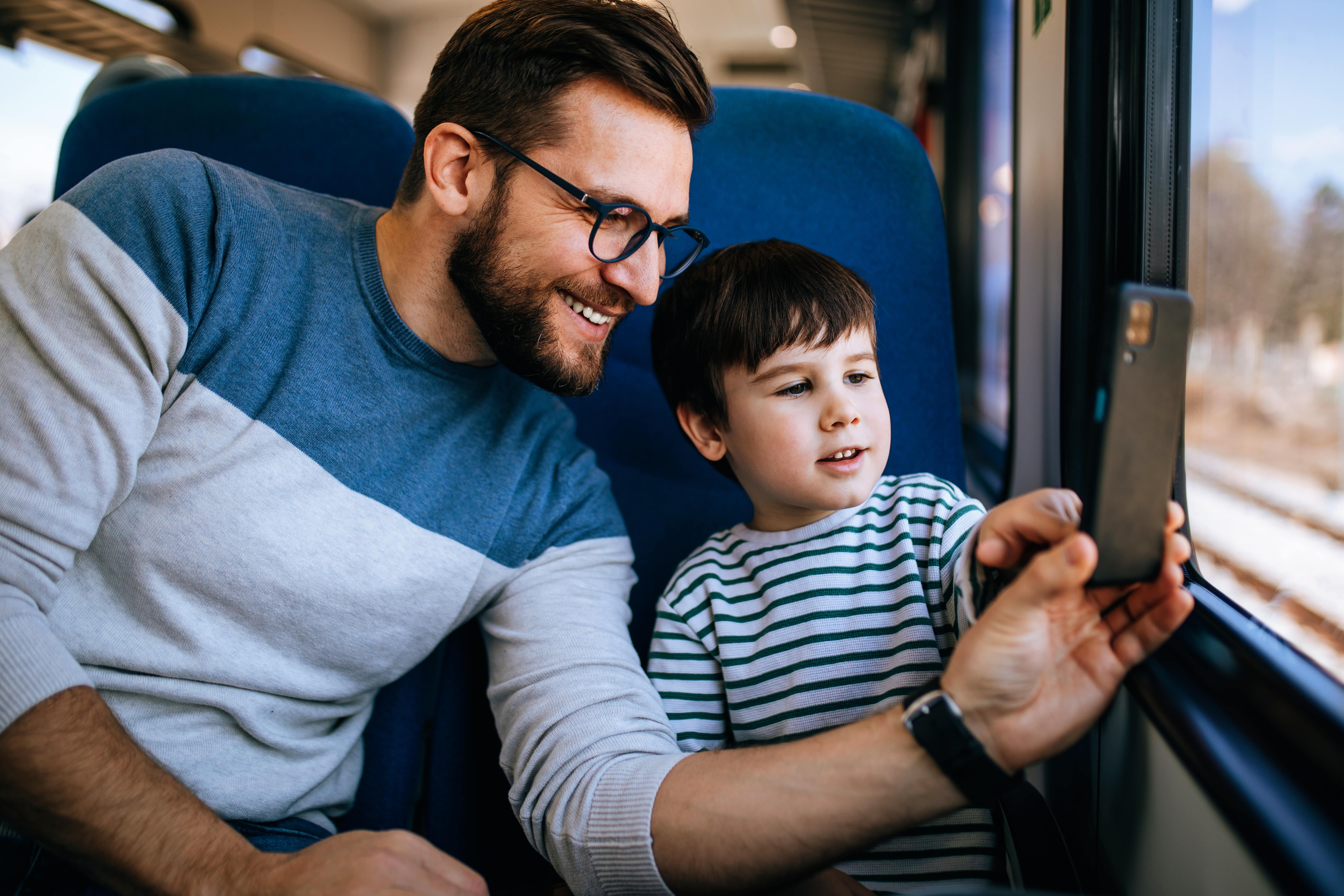 Father and son travelling together on the train