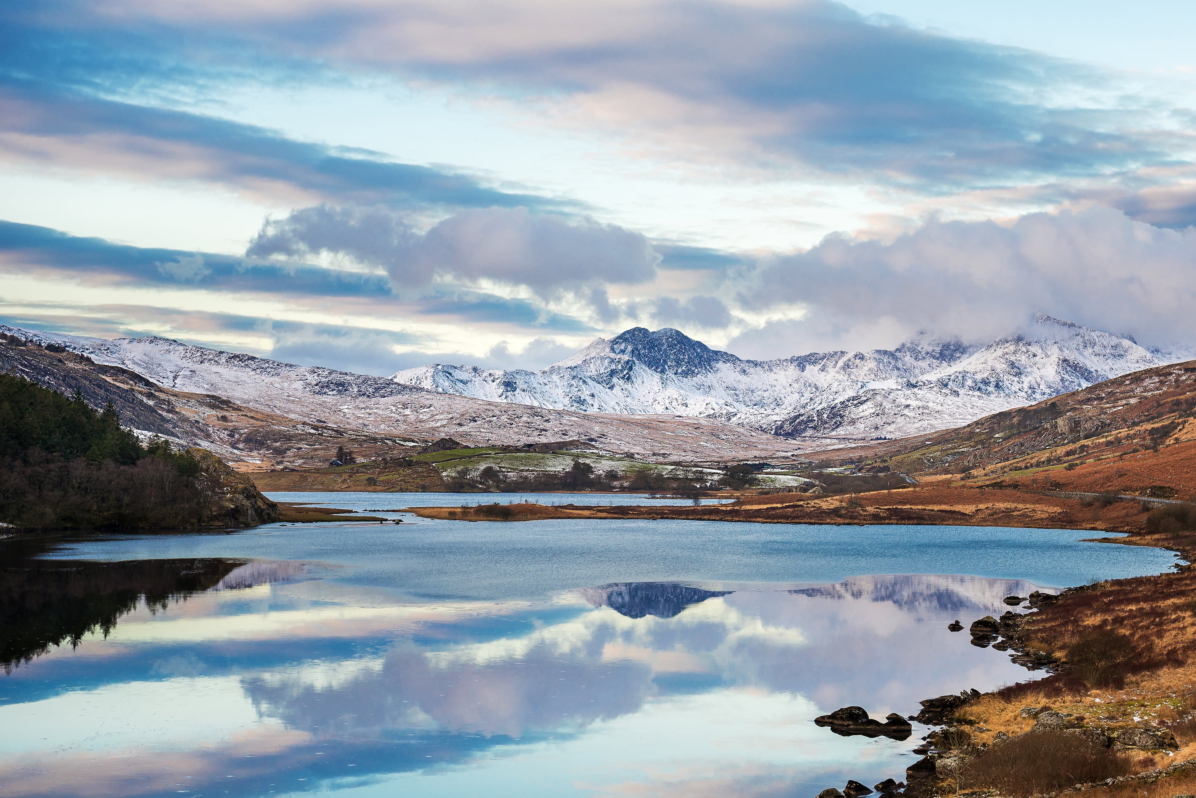 Snowdonian mountains, brushed with snow, stretching out into the distance